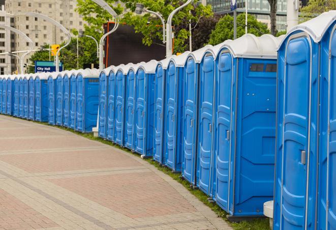 hygienic portable restrooms lined up at a beach party, ensuring guests have access to the necessary facilities while enjoying the sun and sand in Trenton